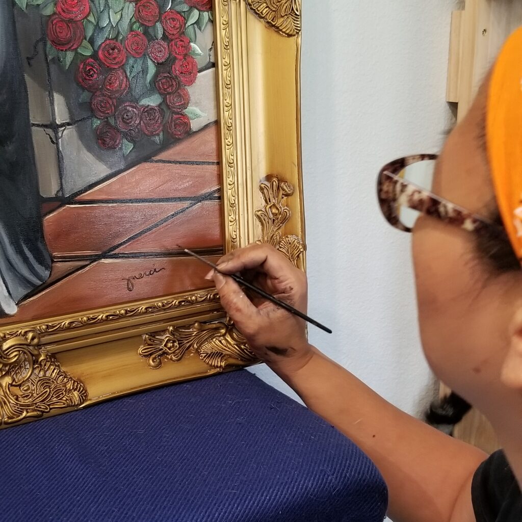 Merci signing the painting